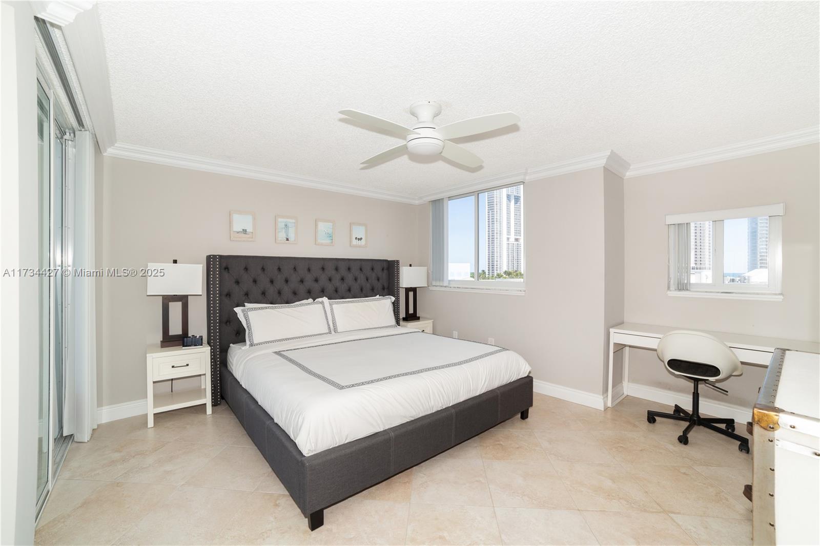 18000 North Bay Road, Unit 602 Sunny Isles Beach, FL 33160 - Photo 10 of 40 a bedroom with a bed and a table