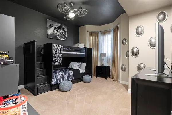 a living room with furniture and a lamp