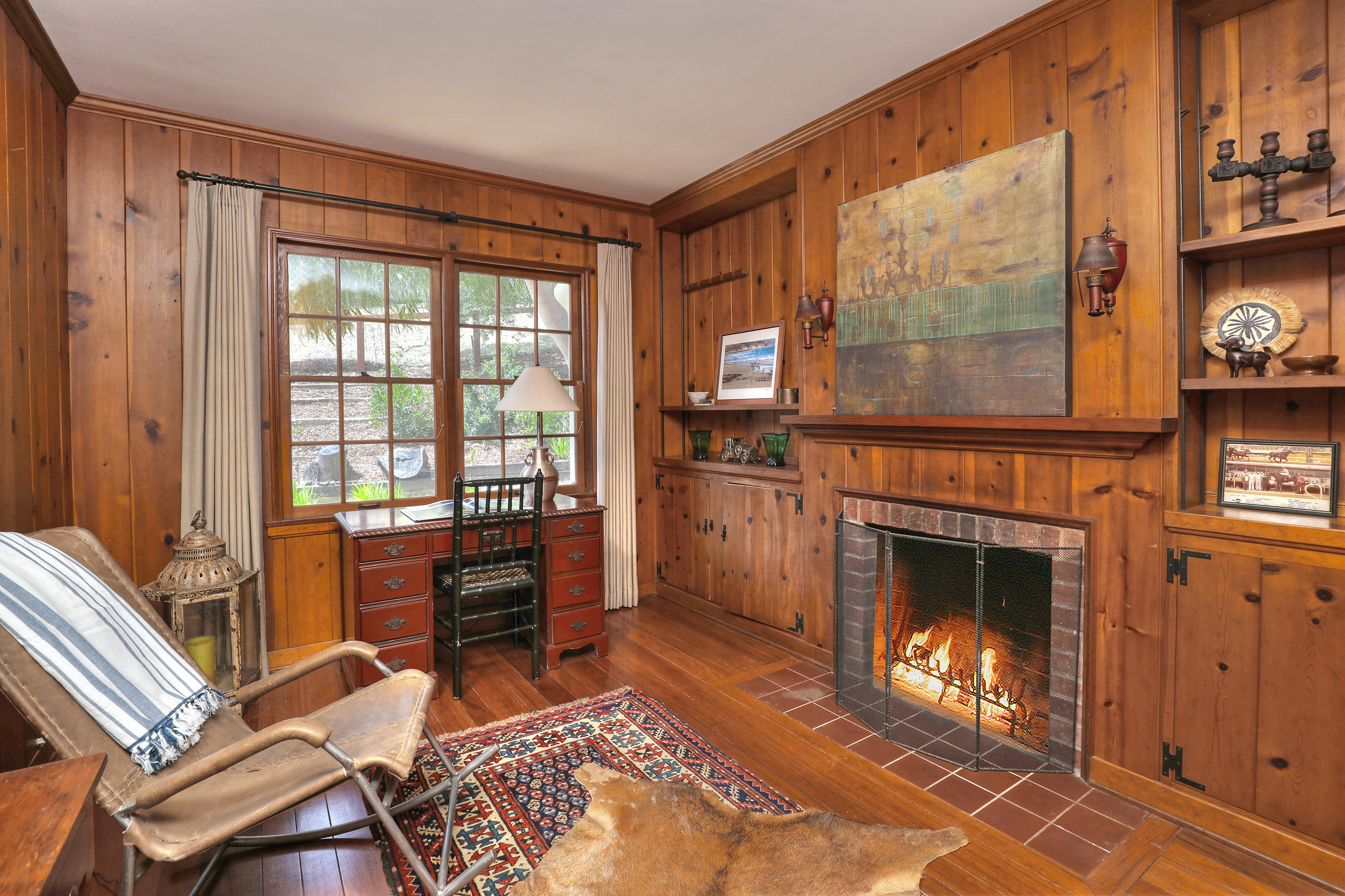 71 Hollister Ranch Road Lompoc, CA 93436 - Photo 11 of 31 a living room with furniture a flat screen tv and a fireplace