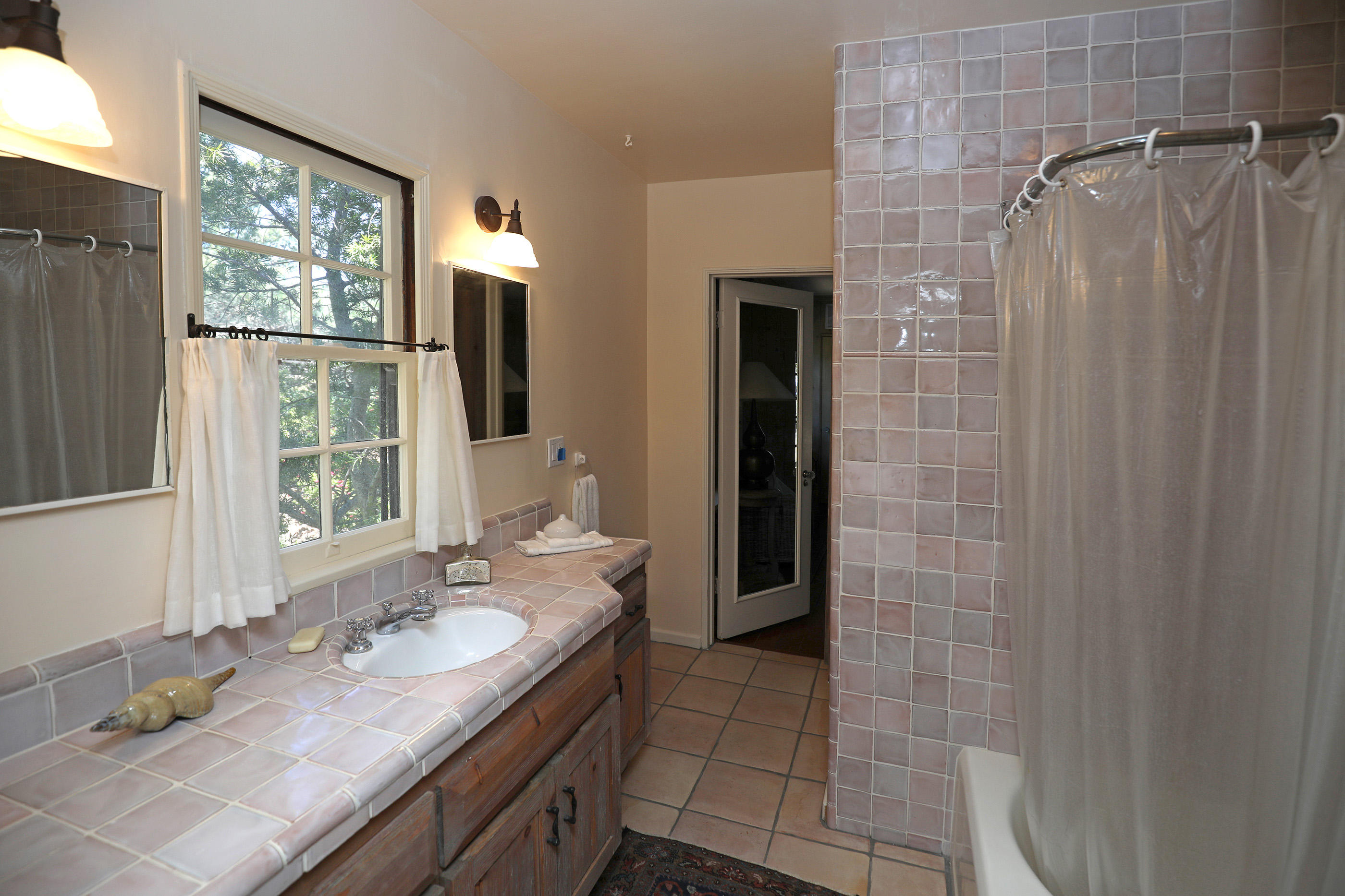 71 Hollister Ranch Road Lompoc, CA 93436 - Photo 13 of 31 a bathroom with a granite countertop sink and a mirror