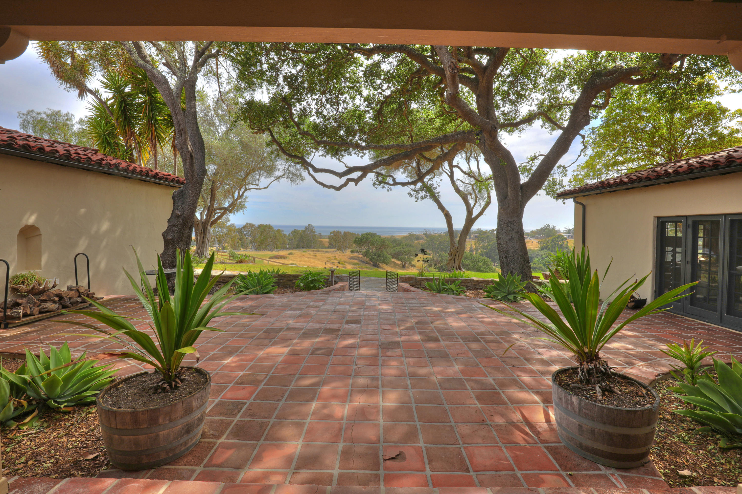 71 Hollister Ranch Road Lompoc, CA 93436 - Photo 4 of 31 a view of a backyard with plants and large trees