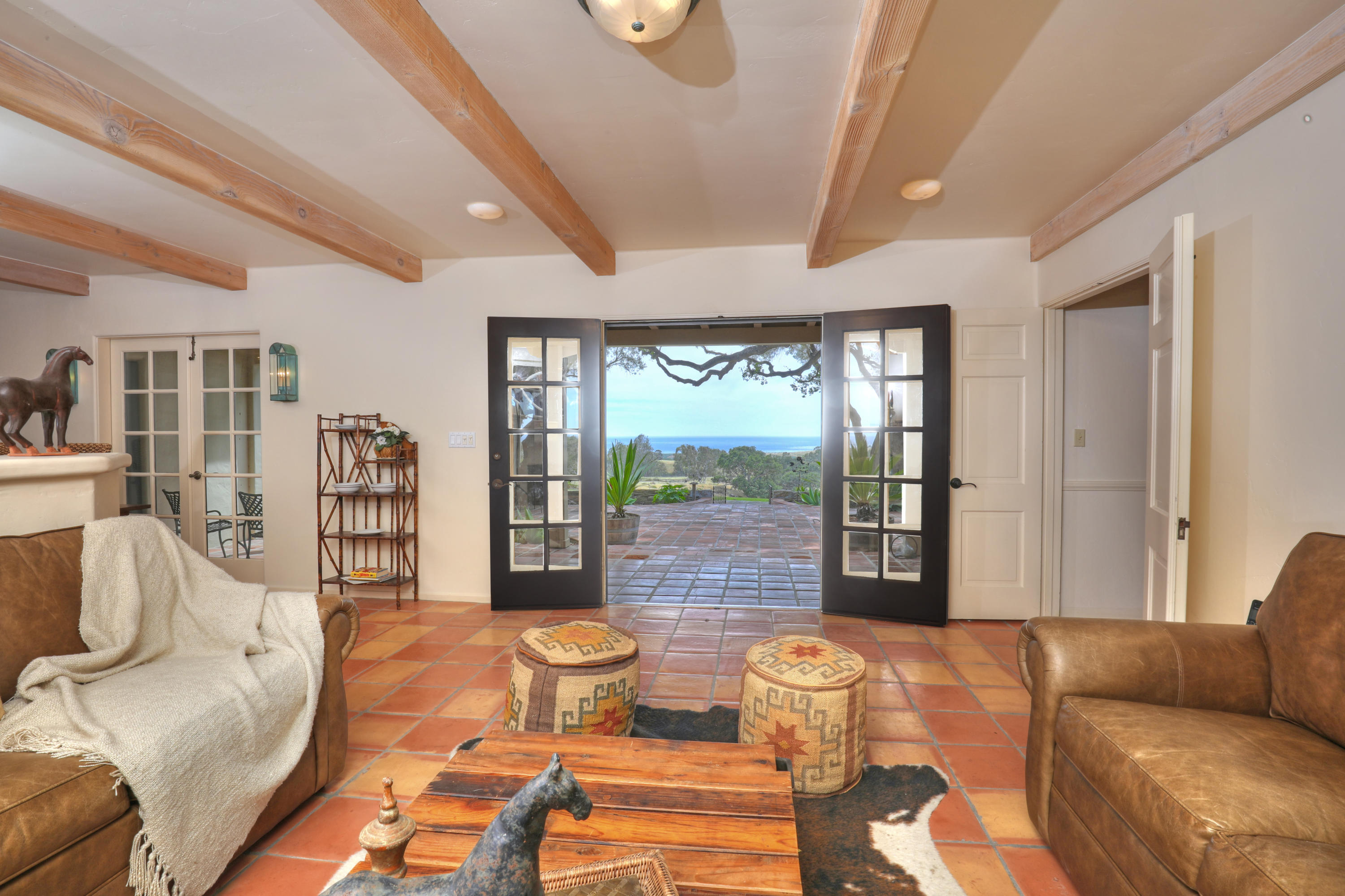 71 Hollister Ranch Road Lompoc, CA 93436 - Photo 5 of 31 a living room with furniture and large windows