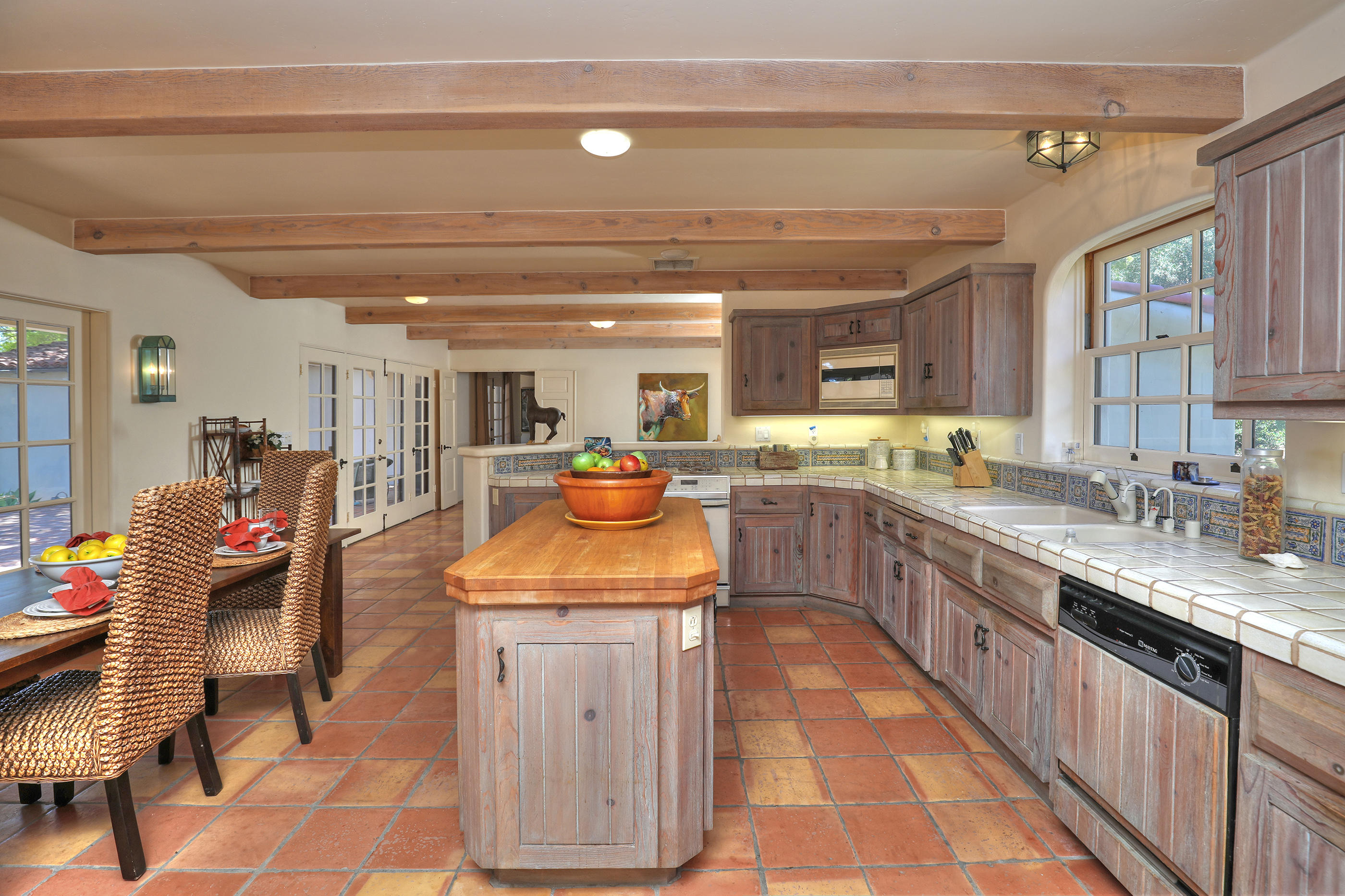 71 Hollister Ranch Road Lompoc, CA 93436 - Photo 9 of 31 a large kitchen with stainless steel appliances kitchen island granite countertop a sink and cabinets