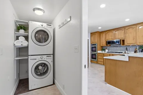 a view of a kitchen with washer and dryer