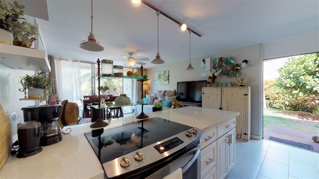 120 Hui Rd F, Unit H4 Lahaina, HI 96761 - Photo 11 of 21 a kitchen with stainless steel appliances granite countertop a sink a stove and a refrigerator