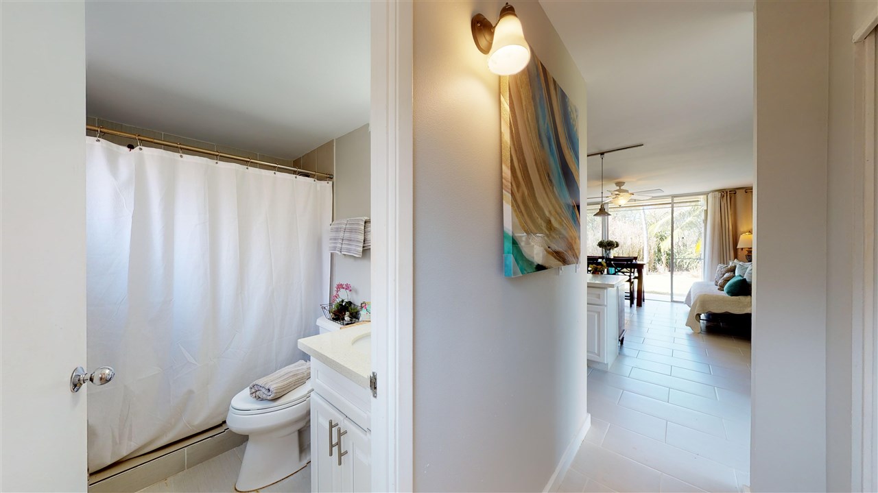 120 Hui Rd F, Unit H4 Lahaina, HI 96761 - Photo 14 of 21 a bathroom with a toilet a sink a shower and a mirror