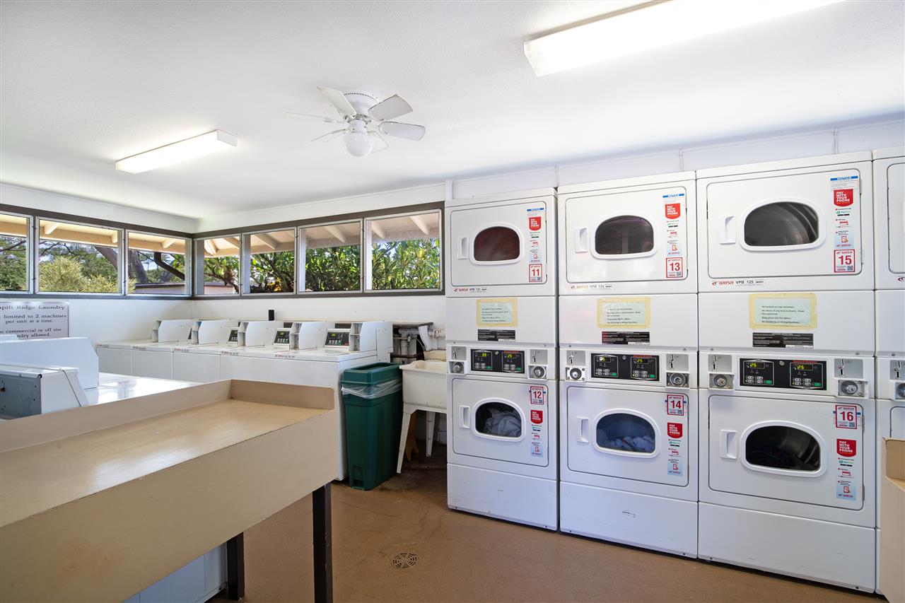 120 Hui Rd F, Unit H4 Lahaina, HI 96761 - Photo 20 of 21 a kitchen with a stove a microwave and a refrigerator