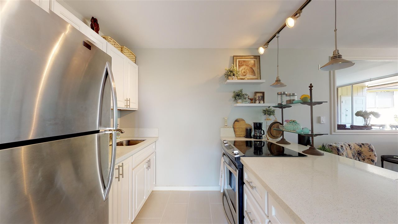 120 Hui Rd F, Unit H4 Lahaina, HI 96761 - Photo 5 of 21 a room with sink a washer and dryer