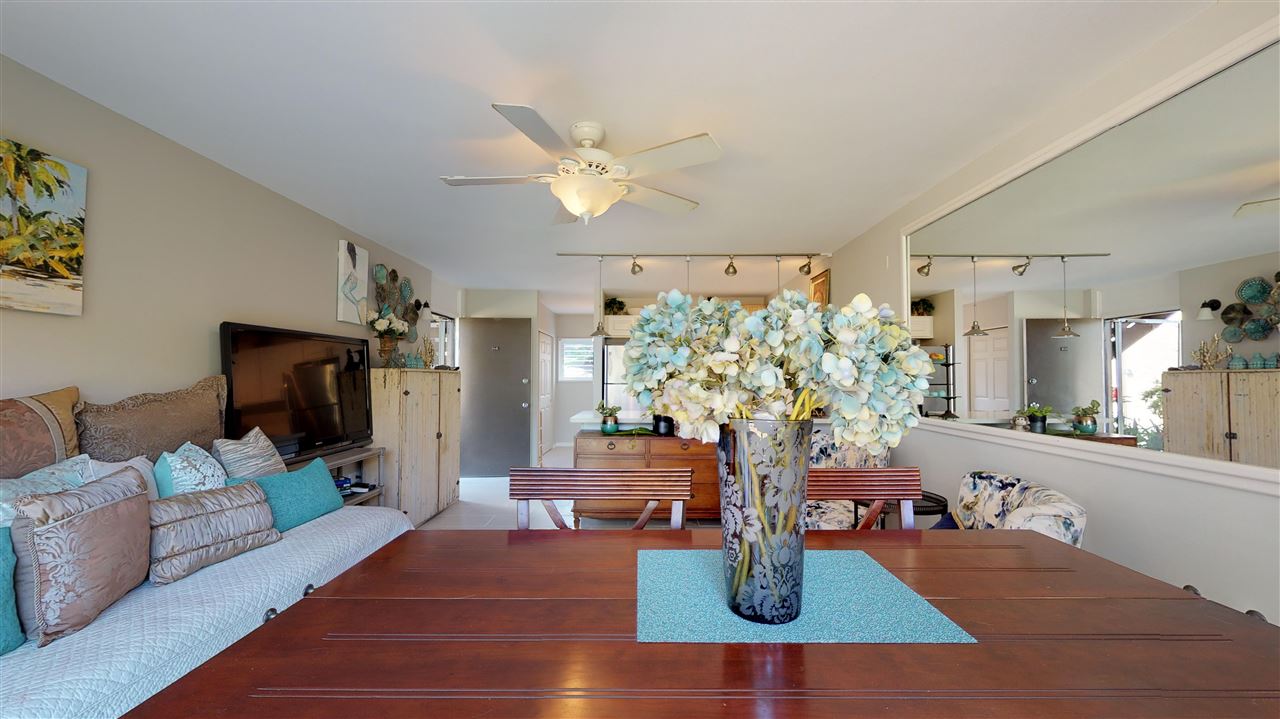 120 Hui Rd F, Unit H4 Lahaina, HI 96761 - Photo 8 of 21 a living room with furniture potted plant and a flat screen tv
