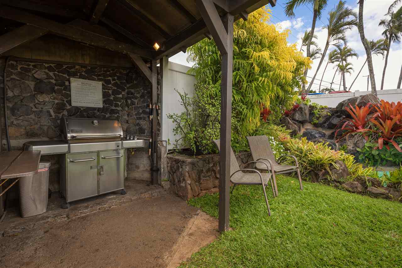 120 Hui Rd F, Unit H4 Lahaina, HI 96761 - Photo 10 of 21 a view of a backyard with plants and a grill