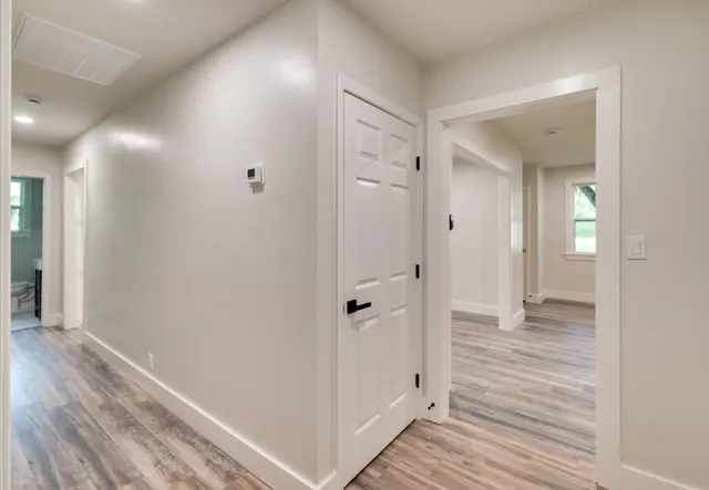 wooden floor with white walls