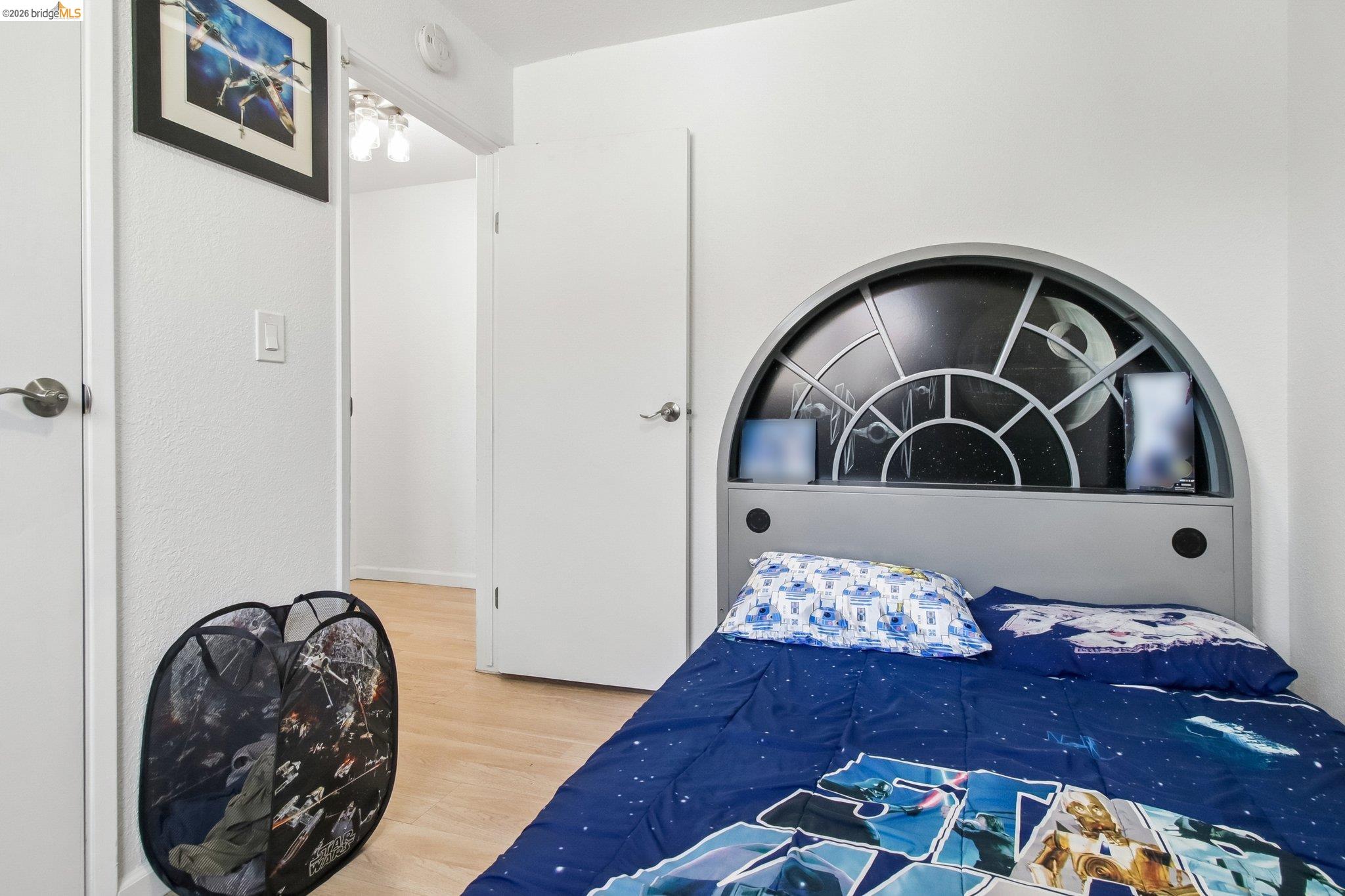 874 Pine Street Oakland, CA 94607 - Photo 22 of 39 White interior walls with light wood-finish flooring