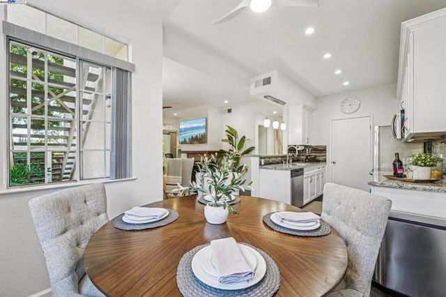a kitchen with furniture and a table