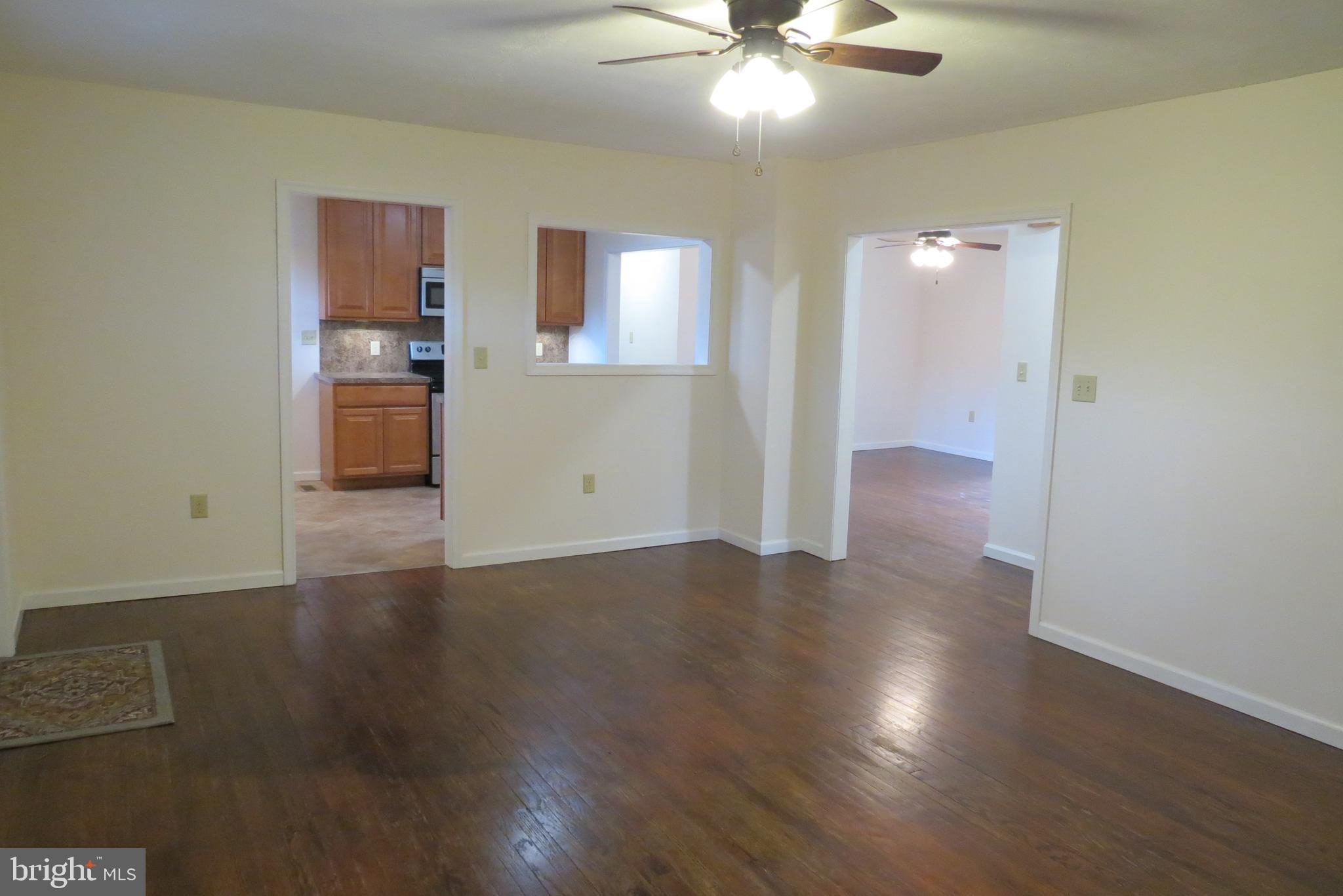 4822 Ridge Road Mount Airy, MD 21771 - Photo 11 of 38 Living room with pass thru to kitchen