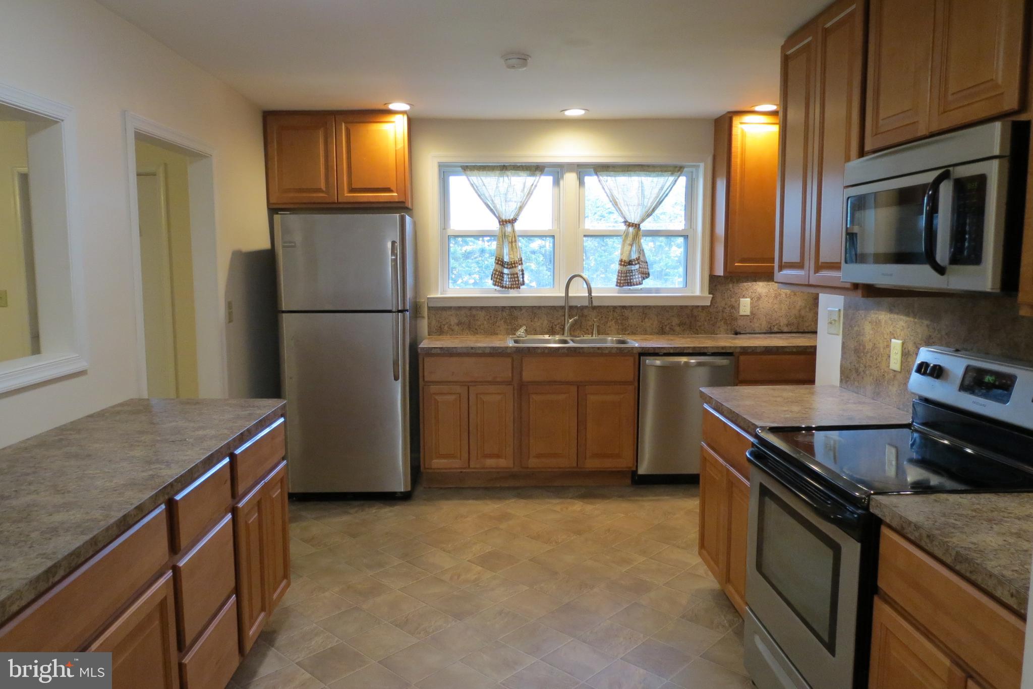 4822 Ridge Road Mount Airy, MD 21771 - Photo 12 of 38 Kitchen with newer maple cabinets, 42" wall cabs