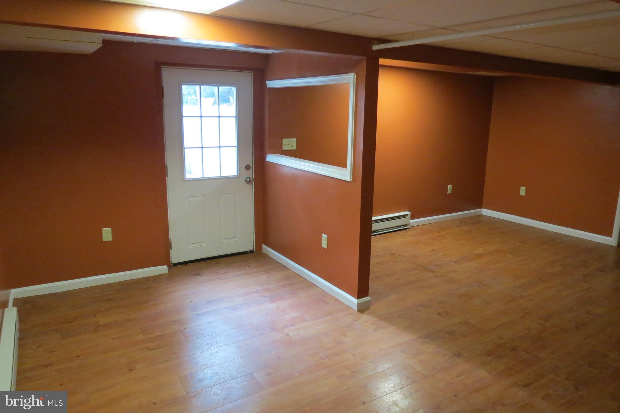 4822 Ridge Road Mount Airy, MD 21771 - Photo 28 of 38 Lower level rec rm with exit to rear yard