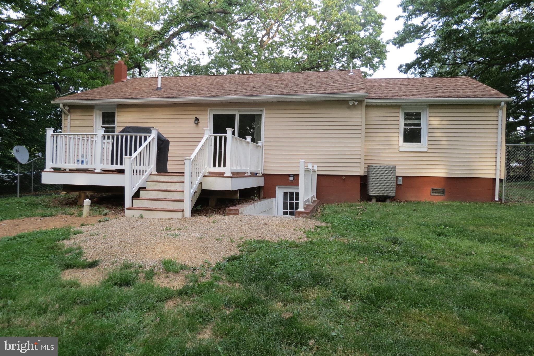 4822 Ridge Road Mount Airy, MD 21771 - Photo 4 of 38 Rear view of trex deck and basement exit