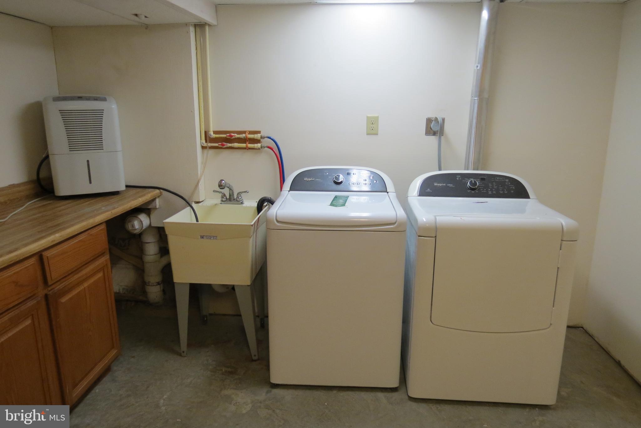 4822 Ridge Road Mount Airy, MD 21771 - Photo 34 of 38 Laundry area with cabinets W & D convey