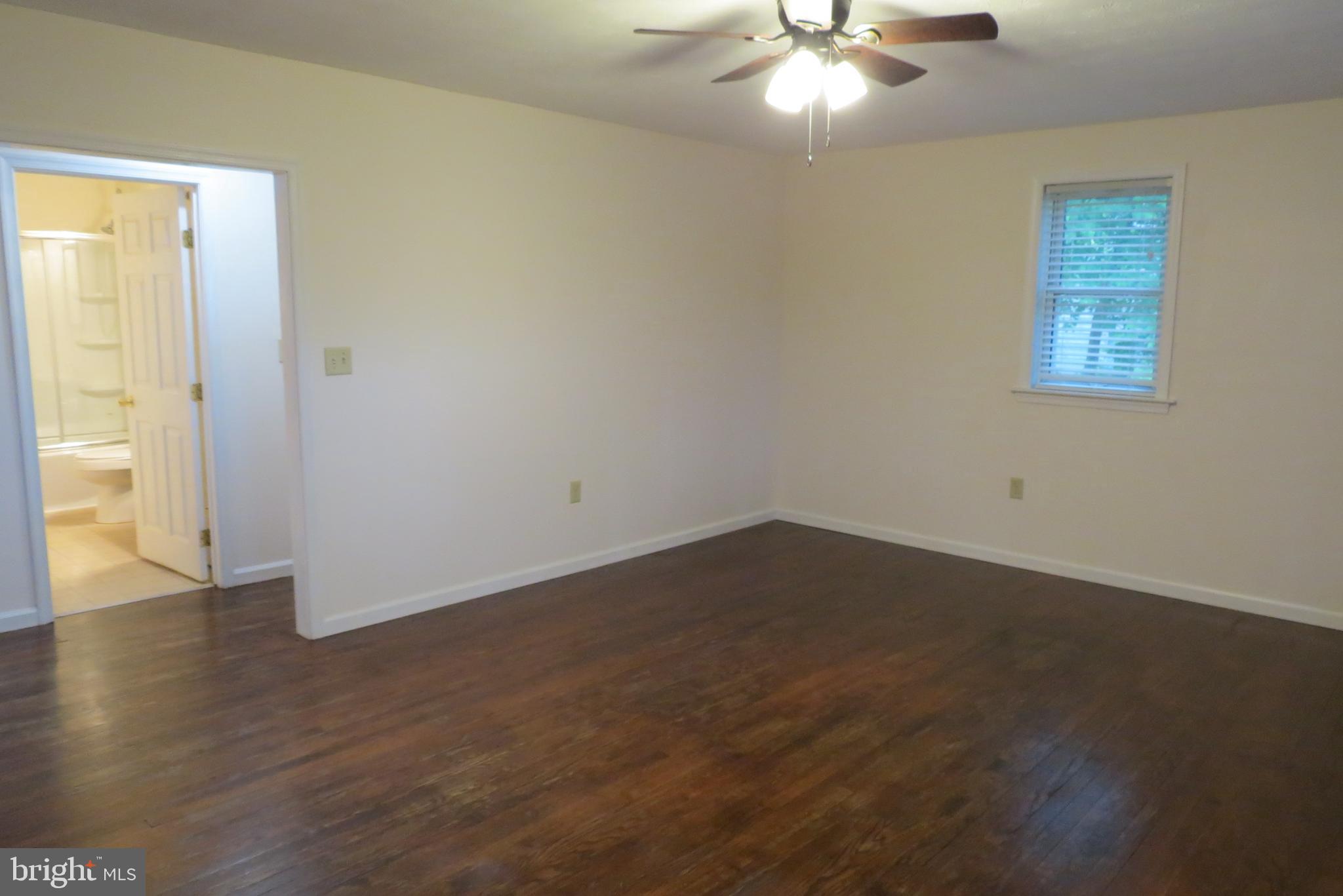 4822 Ridge Road Mount Airy, MD 21771 - Photo 10 of 38 Large living room opens to dining area