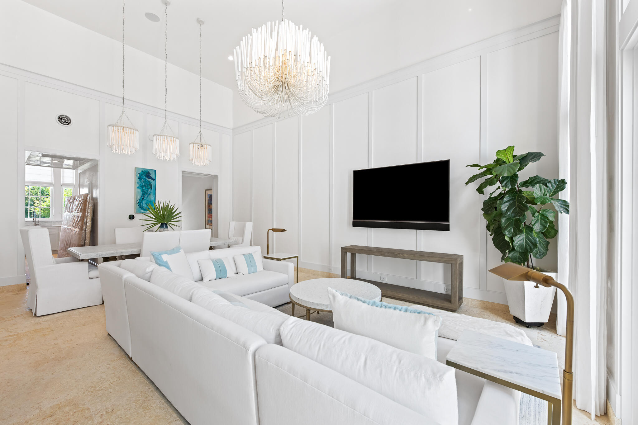 163 North Castle Harbour Dr Inlet Beach, Unit U38 Inlet Beach, FL 32461 - Photo 13 of 55 a living room with furniture a flat screen tv and a chandelier