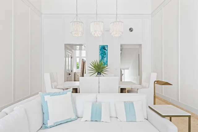 a view of a hallway with wooden floor and entryway