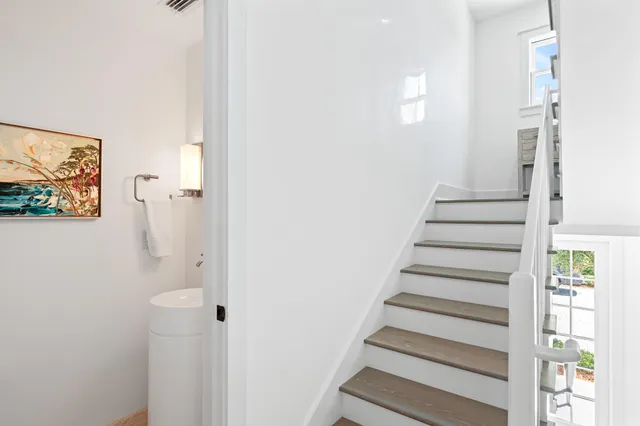 a bedroom with a bed and a lamp