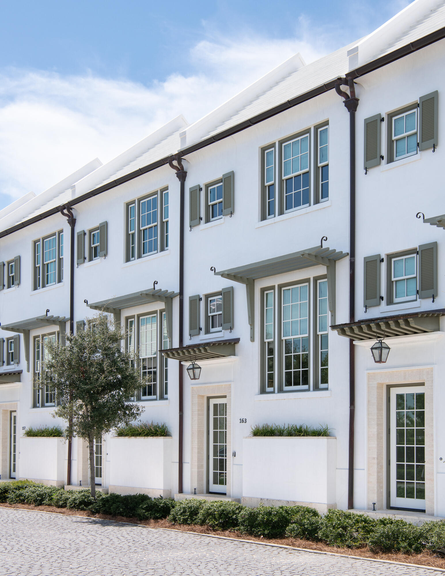 163 North Castle Harbour Dr Inlet Beach, Unit U38 Inlet Beach, FL 32461 - Photo 2 of 55 a front view of a house with a yard and garage