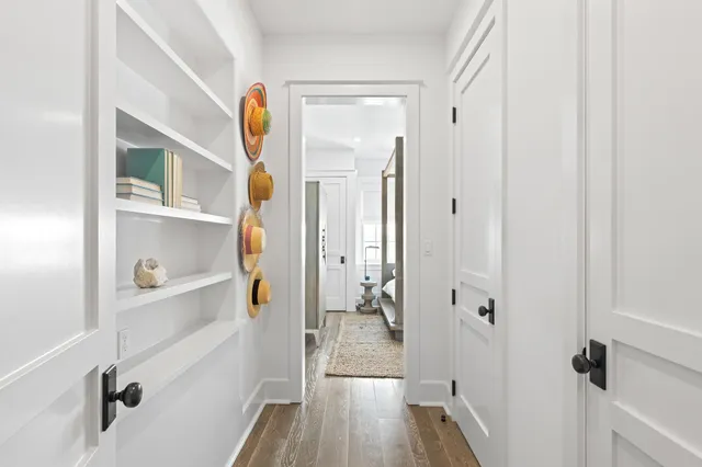 a bedroom with a bed and a flat tv screen on dresser