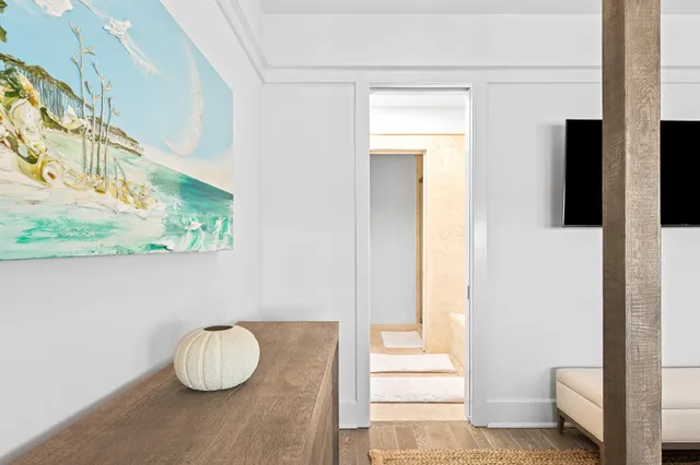 a bedroom with a bed and a flat tv screen