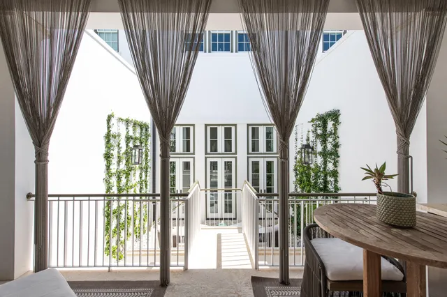 a view of a chairs and table in the room