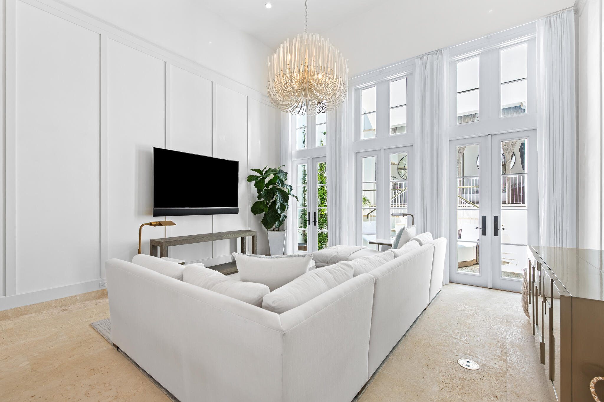 163 North Castle Harbour Dr Inlet Beach, Unit U38 Inlet Beach, FL 32461 - Photo 8 of 55 a living room with furniture a flat screen tv and a chandelier