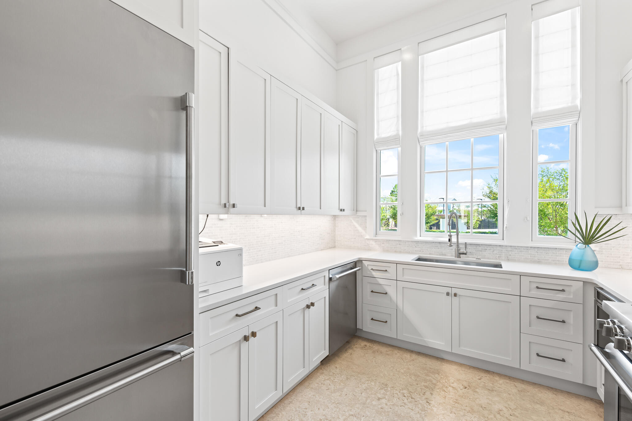 163 North Castle Harbour Dr Inlet Beach, Unit U38 Inlet Beach, FL 32461 - Photo 10 of 55 a kitchen with white cabinets and sink