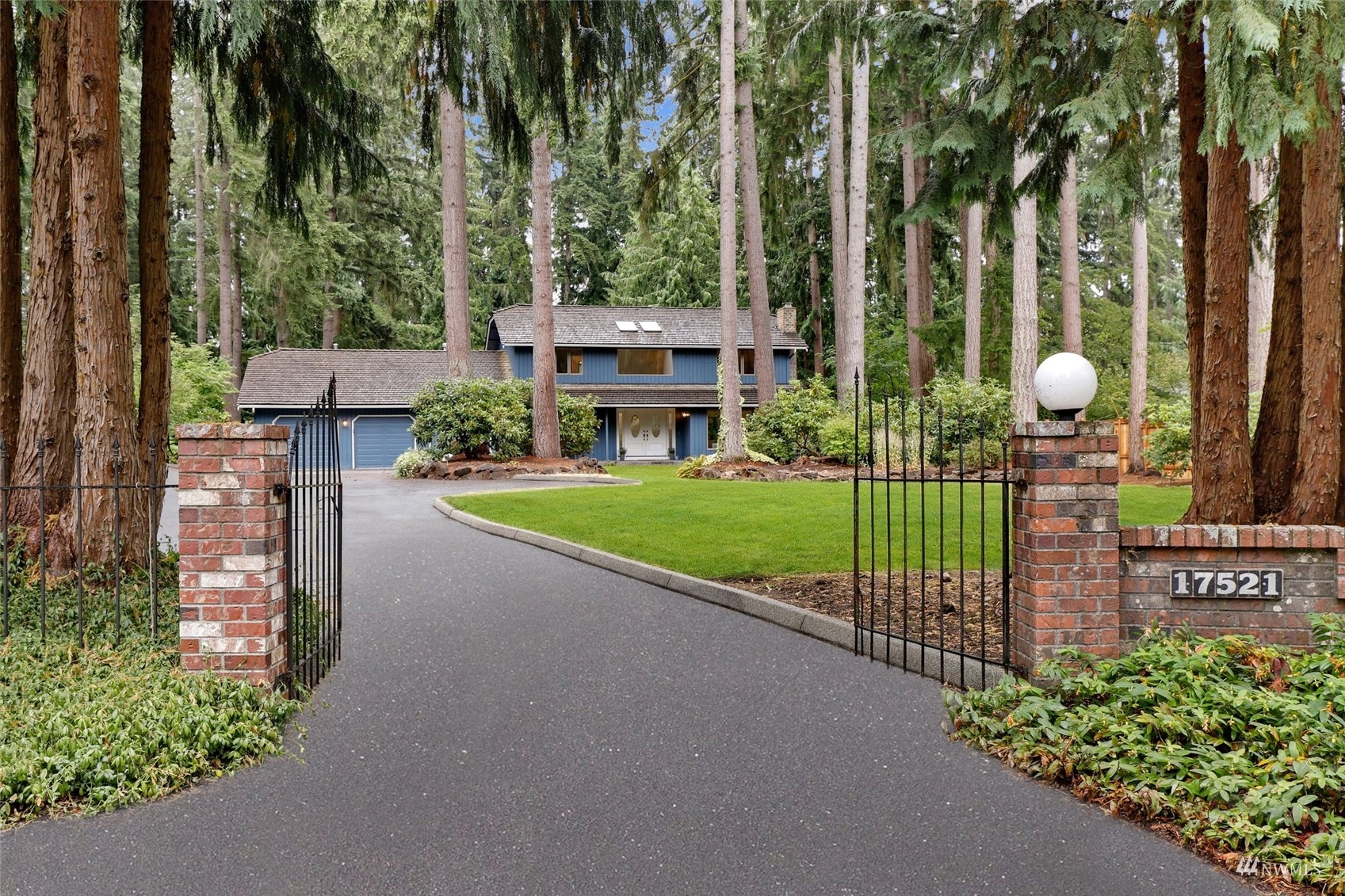 17521 5th Avenue West Bothell, WA 98012 - Photo 1 of 40 a view of a park with a bench and trees