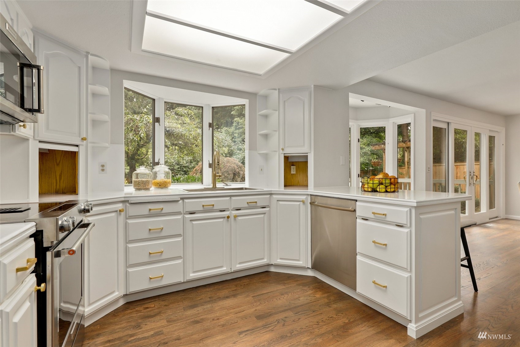 17521 5th Avenue West Bothell, WA 98012 - Photo 12 of 40 a kitchen with white cabinets and a window