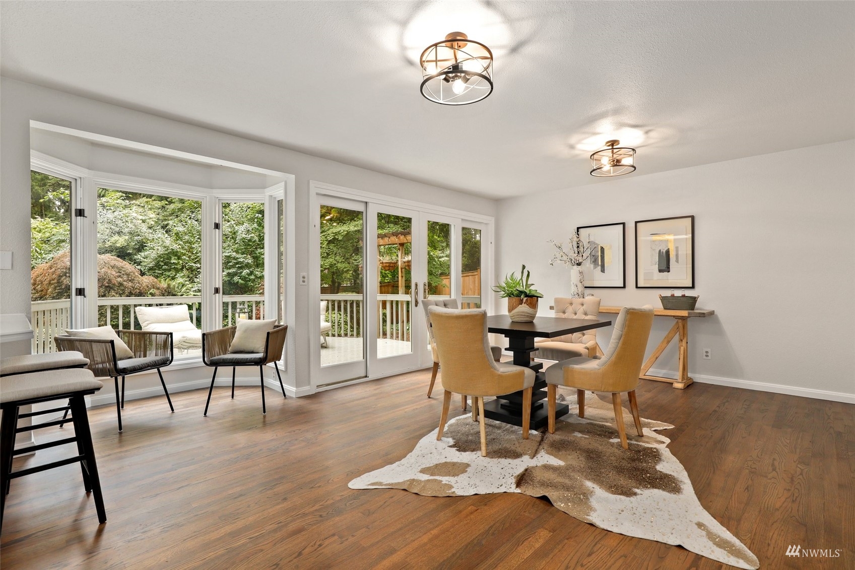 17521 5th Avenue West Bothell, WA 98012 - Photo 16 of 40 a view of a dining room with furniture window and wooden floor