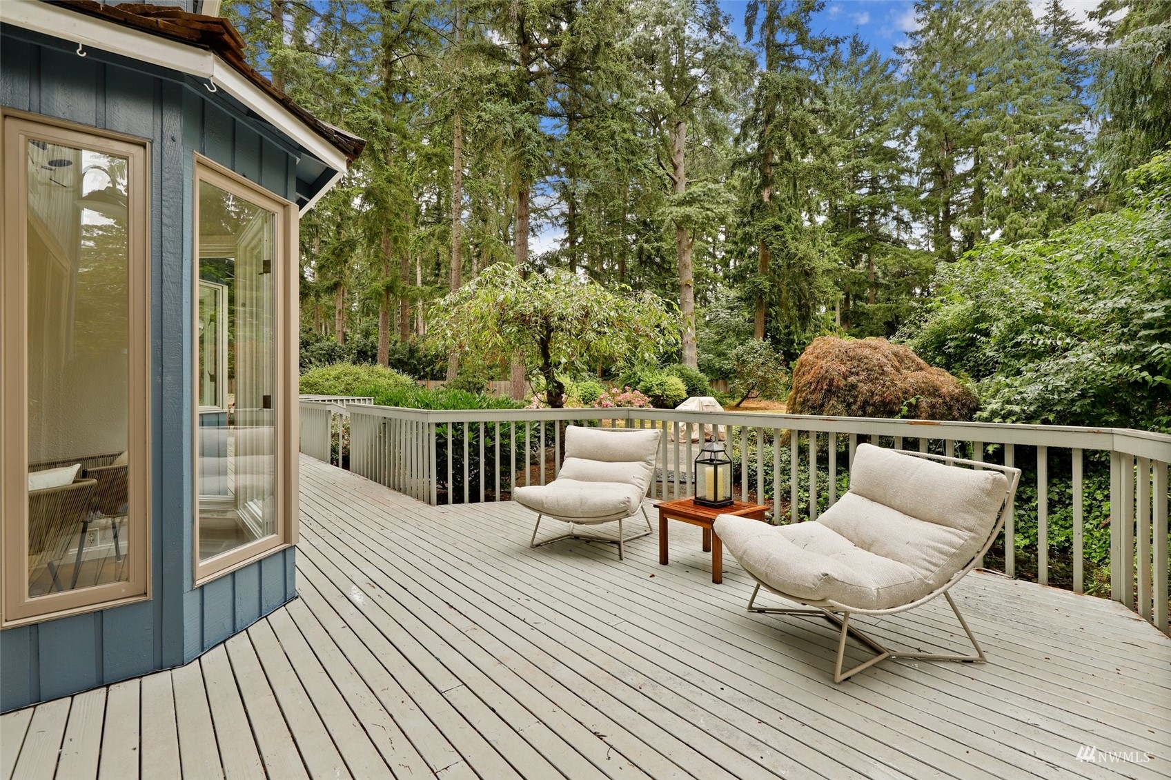 17521 5th Avenue West Bothell, WA 98012 - Photo 17 of 40 a balcony with wooden floor table and chairs