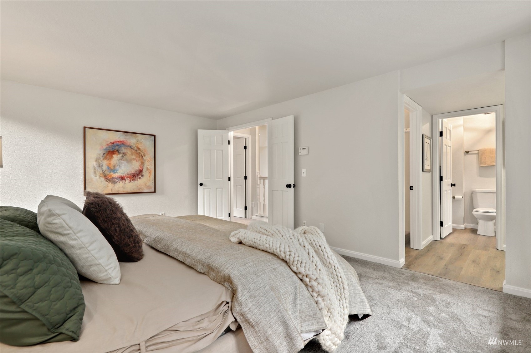 17521 5th Avenue West Bothell, WA 98012 - Photo 26 of 40 a bedroom with a bed and a painting on the wall
