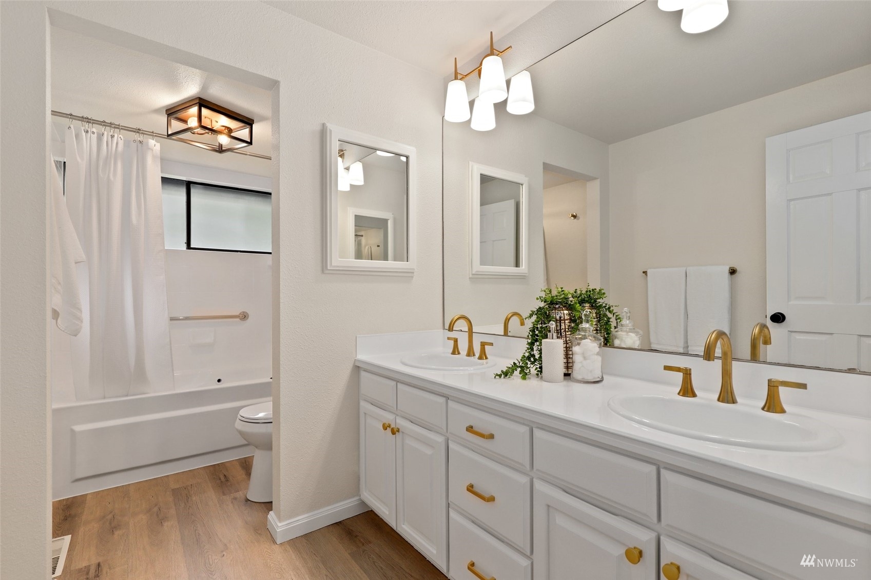 17521 5th Avenue West Bothell, WA 98012 - Photo 32 of 40 a bathroom with a double vanity sink and a mirror
