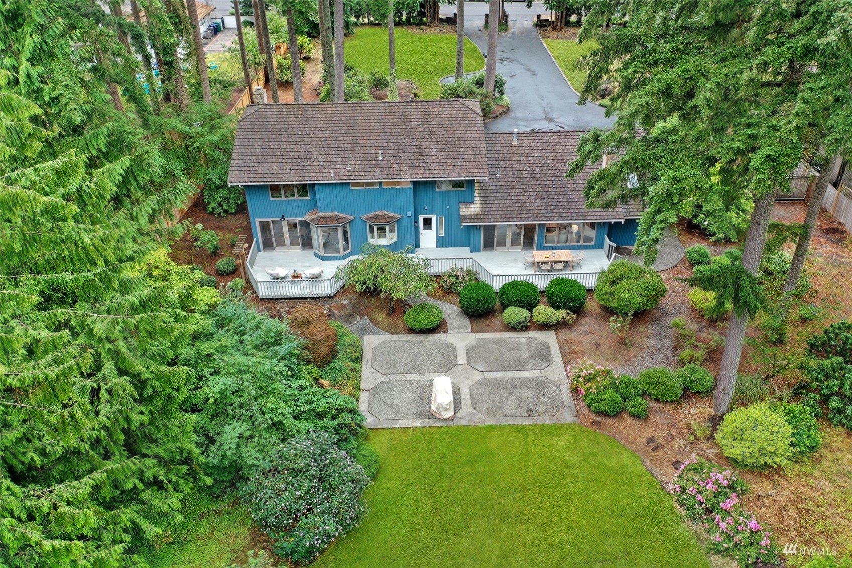 17521 5th Avenue West Bothell, WA 98012 - Photo 33 of 40 an aerial view of a house with table and chairs under an umbrella