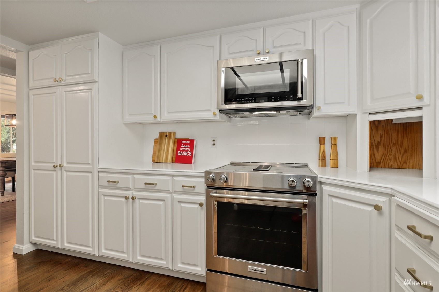 17521 5th Avenue West Bothell, WA 98012 - Photo 10 of 40 a kitchen with stainless steel appliances granite countertop grey cabinets and a stove top oven