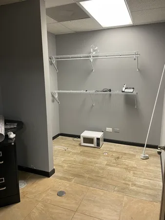 a bathroom with a toilet a sink and a mirror
