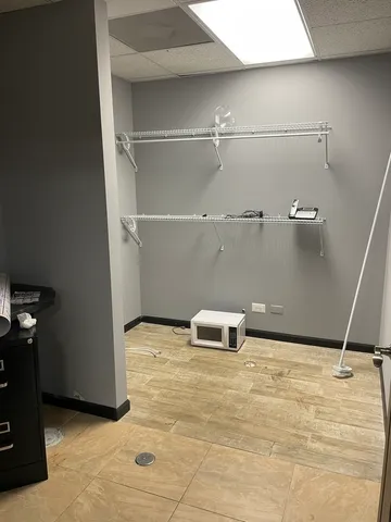 a bathroom with a toilet a sink and a mirror