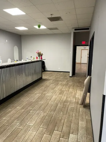 a bathroom with a granite countertop sink and a large mirror