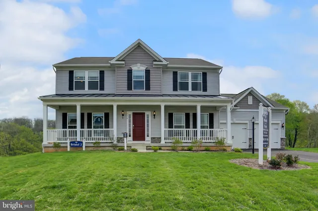a front view of a house with yard
