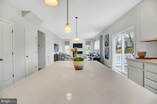 a large open kitchen with a table and chairs