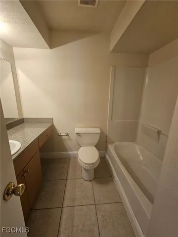 a bathroom with a toilet a sink and bathtub