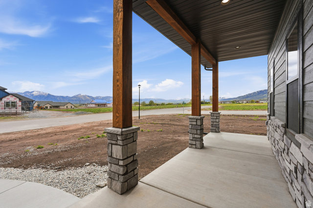 2970 North Mahogany Vly Road Logan, UT 84341 - Photo 3 of 39 Covered porch featuring a mountain view