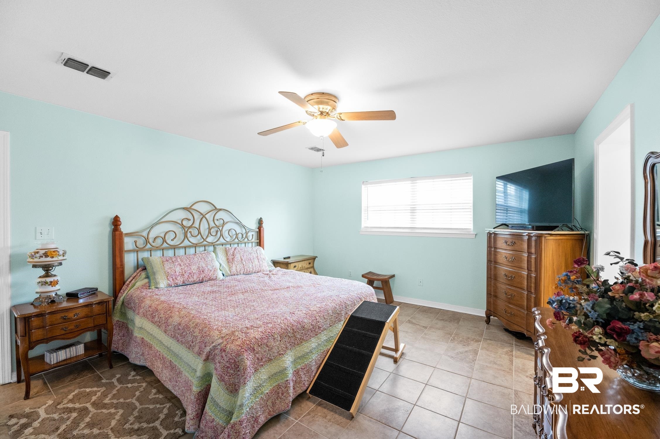 2553 Santa Rosa Drive Lillian, AL 36549 - Photo 24 of 51 Bedroom with a ceiling fan, visible vents, baseboards, and light tile patterned flooring