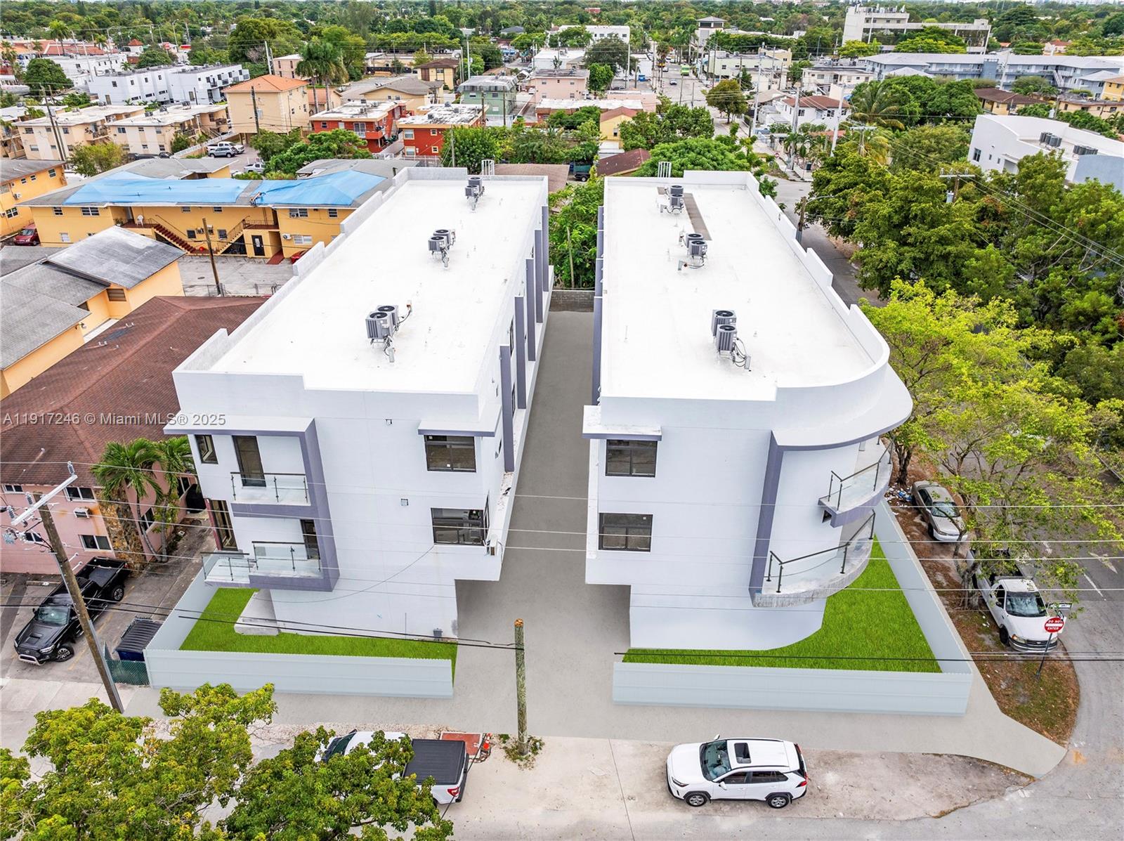 1780 Southwest 5th Street, Unit 1 Miami, FL 33135 - Photo 2 of 29 an aerial view of residential houses with outdoor space and parking