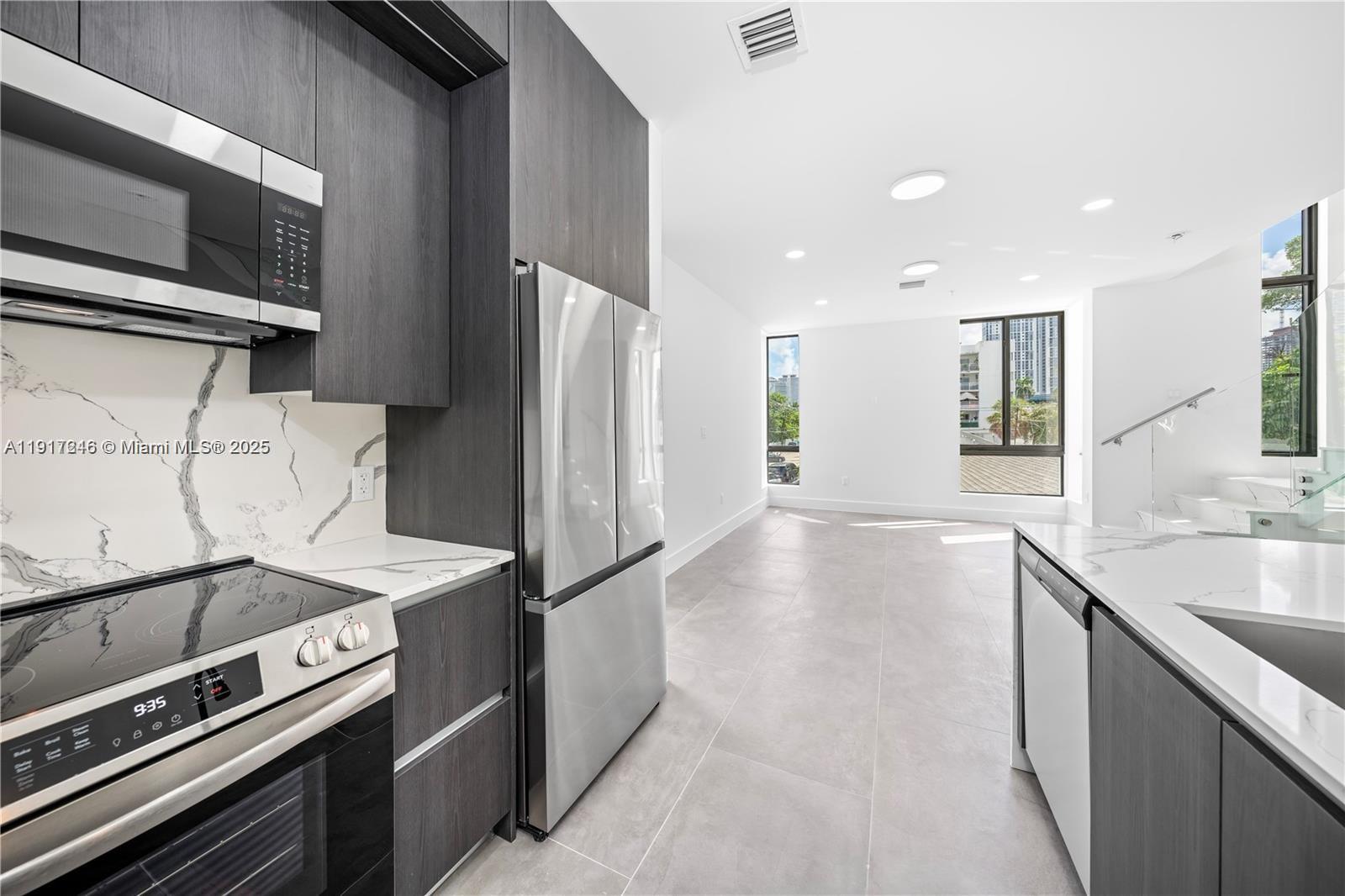 1780 Southwest 5th Street, Unit 1 Miami, FL 33135 - Photo 3 of 29 a kitchen that has a sink and a stove
